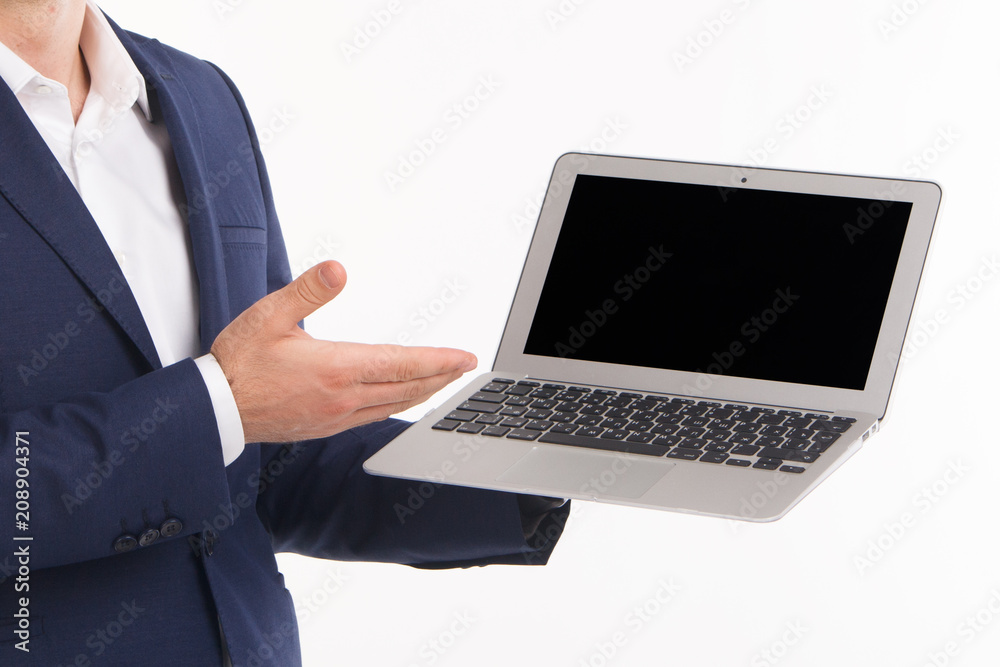 Male hand points to a laptop screen with copy space on white background Male hand points to a laptop screen with copy space on white background