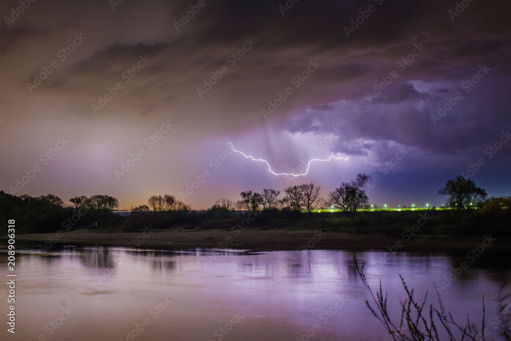 Rain and lightning above the river Rain and lightning above the river