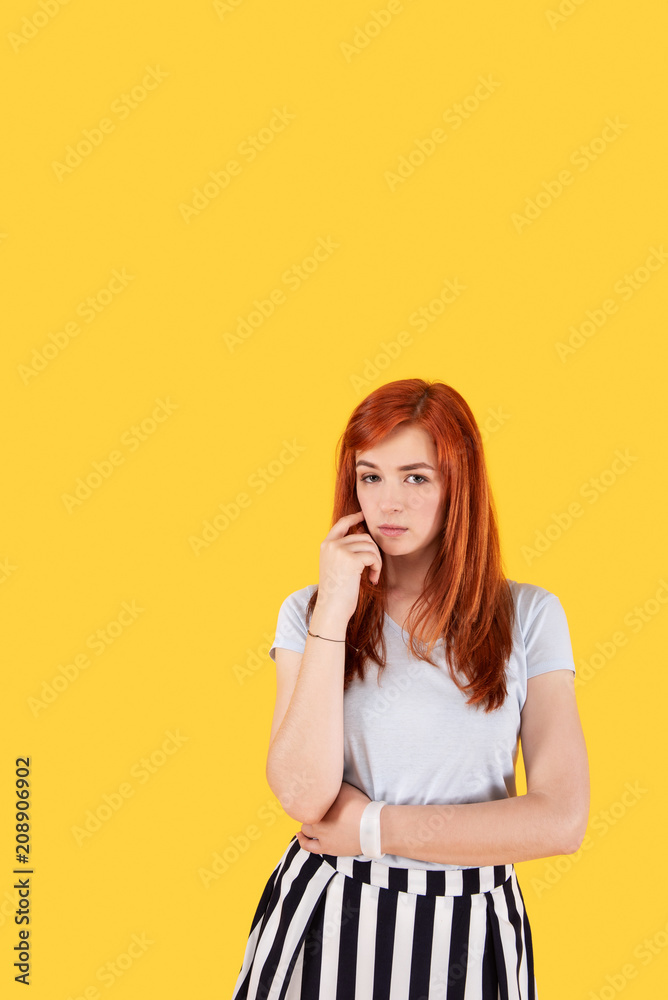 New ideas. Serious attractive woman thinking while looking for new ideas New ideas. Serious attractive woman thinking while looking for new ideas