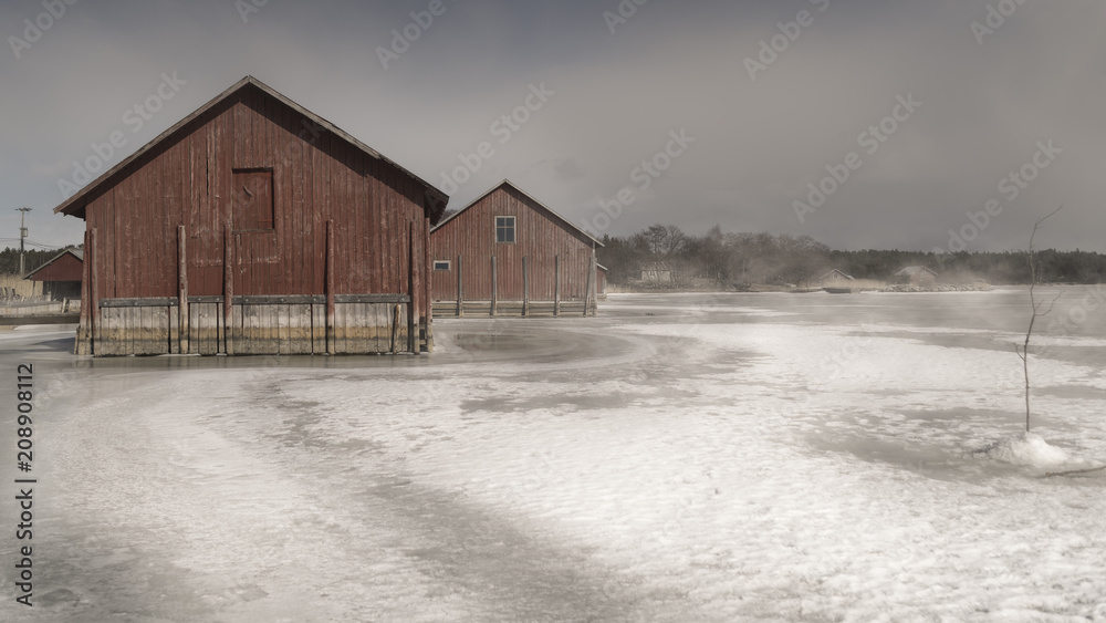 Red boathouses in finnish archipelago.
Red boathouses in finnish archipelago.