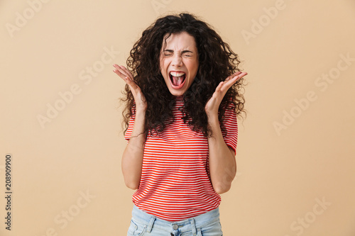 Agressive displeased screaming young woman