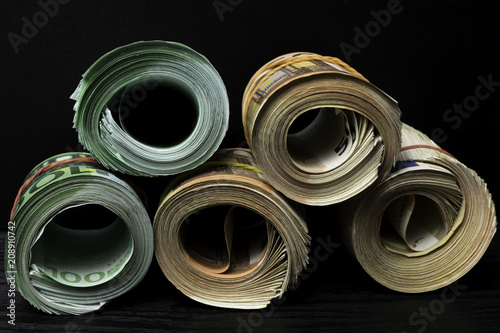 фотографія Rolled several thousand euro banknotes.