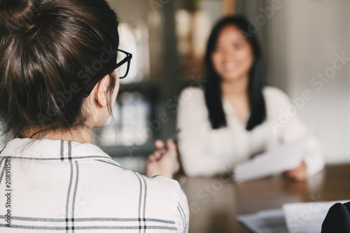 Φωτογραφία Business, career and placement concept -photo from back of businesswoman intervi