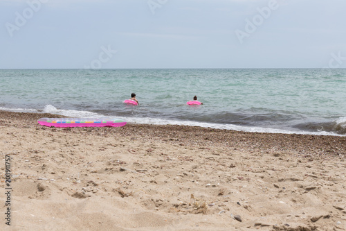 children bathe in the sea