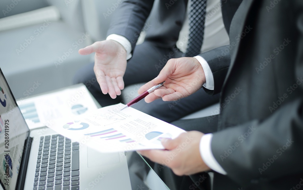 Business team hands at work with financial reports Business team hands at work with financial reports
