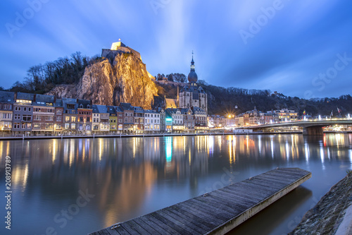 Dinant cityscape, Belgium. Collegiate Church of Our Lady near Meuse river.