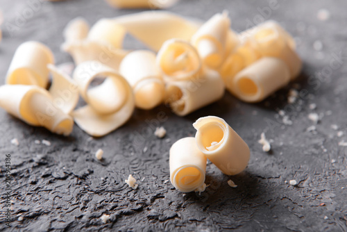 Chocolate curls on grey textured background