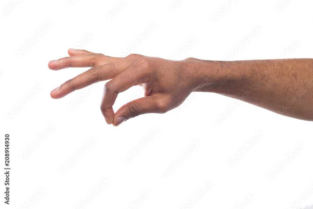Male hand picking up something, cutout Male hand picking up something, cutout