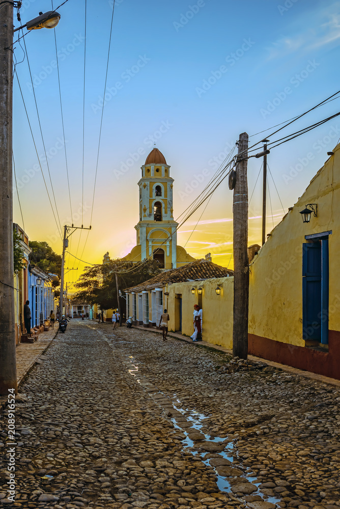 sunset behind the church tower in trinidad, cuba