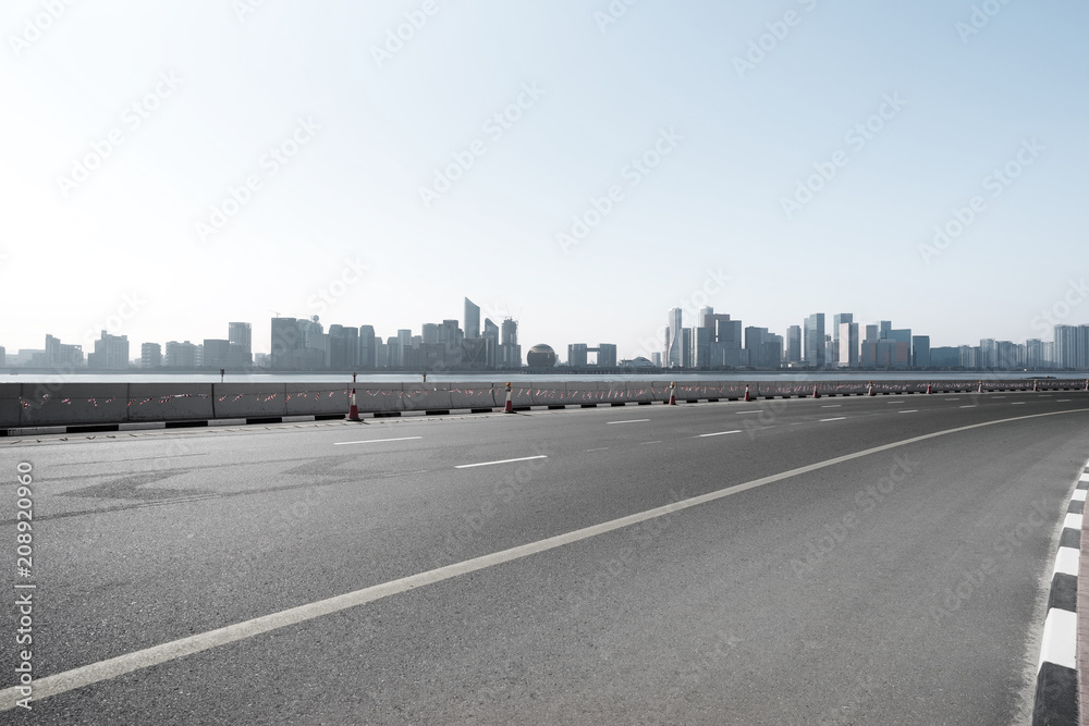 empty road with city skyline
