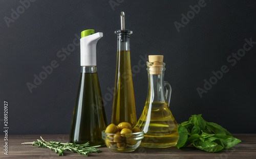 Fototapeta Naklejka Na Ścianę i Meble -  Glassware with olive oil on wooden table