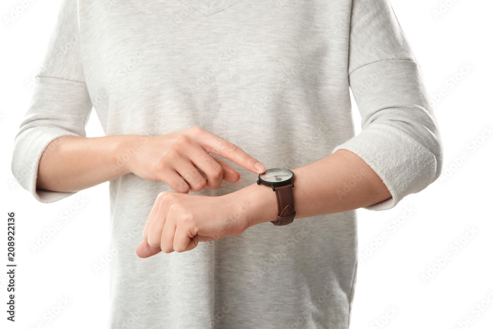Woman looking at watch on white background. Time management concept