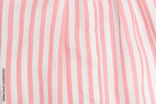 Pink and white striped seamless fabric. Close up