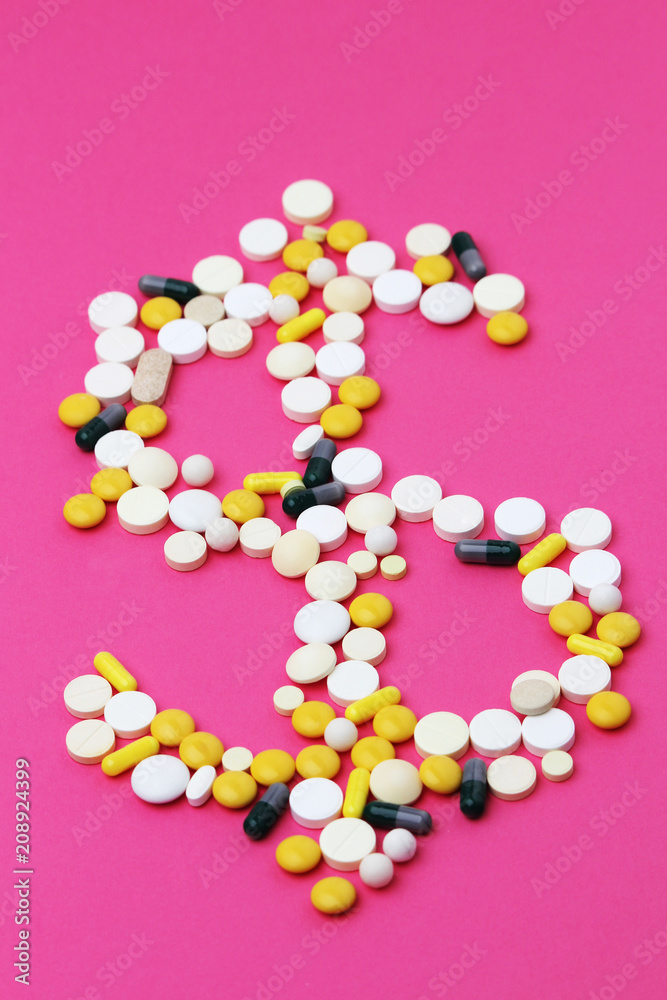 Medicine forming a sign of dollar as a concept of high cost of healthcare Medicine forming a sign of dollar as a concept of high cost of healthcare