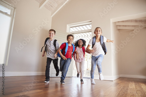 Group Of Children Returning Home After School Day