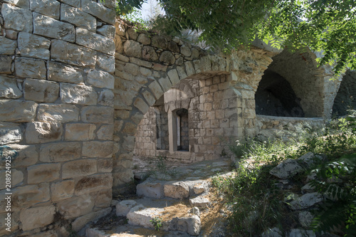 Ruins  of abandoned Palestinian village Kafr Birim in the north of Israel in which the christians Maronites lived until the middle of the 20th century photo