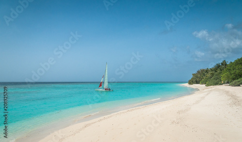 Maldives sailing beautiful beach background white sandy tropical paradise island with blue sky sea water ocean 