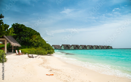 Tropical white sand beach. Maldives, water villas  © Maria