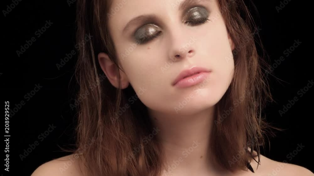 sensual young brunette woman with smokey cream eyeshadow video portrait on black background sensual young brunette woman with smokey cream eyeshadow video portrait on black background