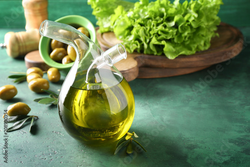 Fototapeta Naklejka Na Ścianę i Meble -  Bottle with fresh olive oil on table