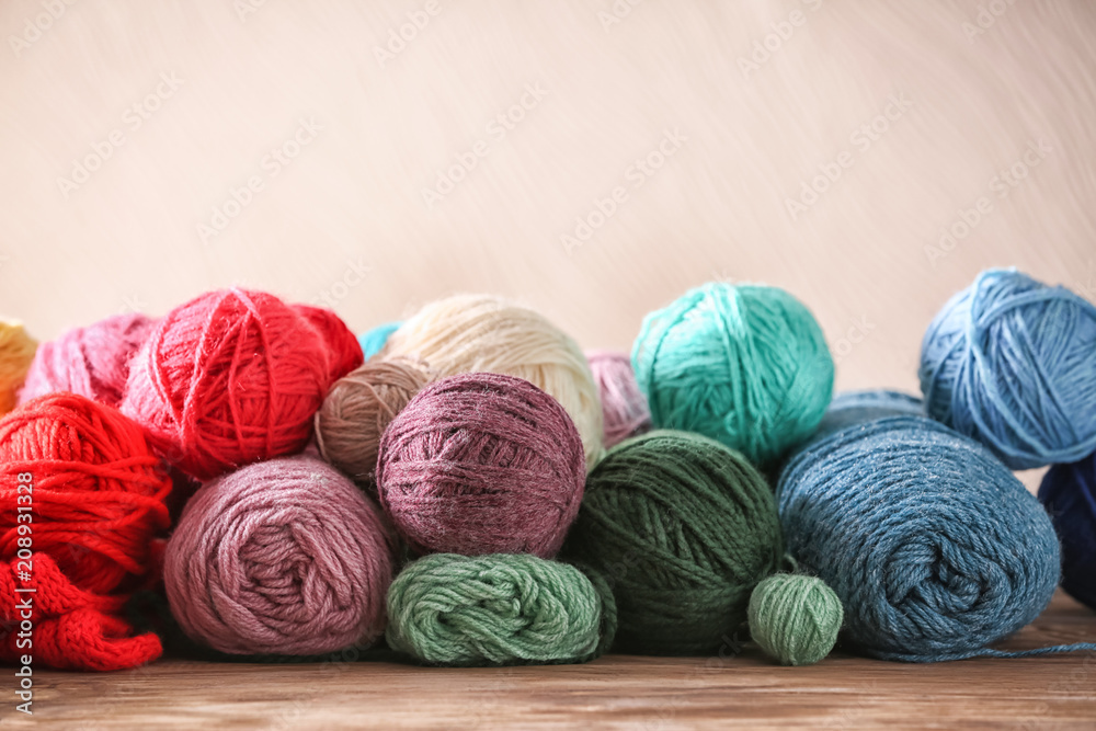 Colorful knitting yarn on wooden table Colorful knitting yarn on wooden table