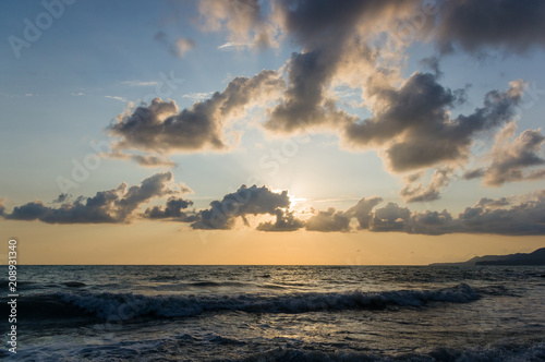 Amazing sea sunset, the sun, waves, clouds