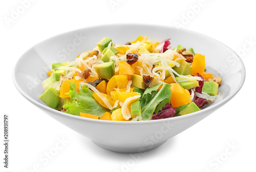 Plate of tasty salad with ripe avocado on white background