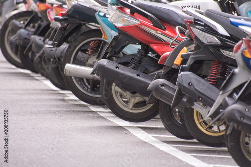 Taipei  Taiwan - June 10  2018   A row of motorcycle parking along the roadside in Taipei s street  Taiwan