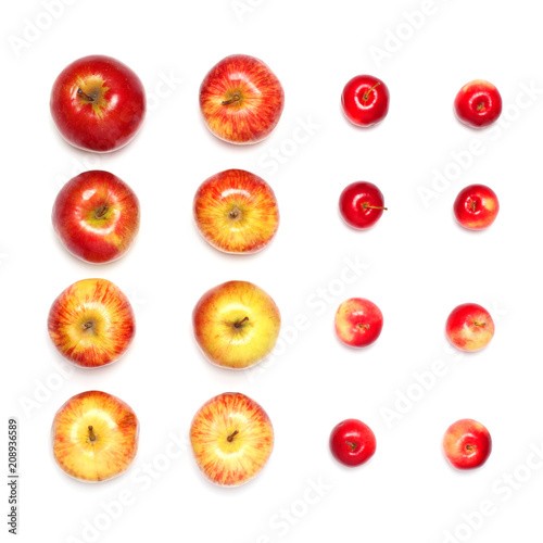 many different red apples fruits in a row isolated on a white background