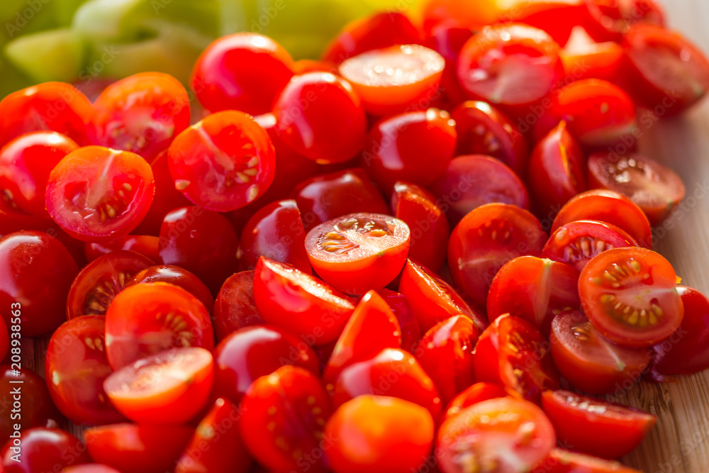 Tomatoes macro, red healthy vegetable sliced on wooden desk. Macro detail of red fresh tomato from garden. Tomatoes macro, red healthy vegetable sliced on wooden desk. Macro detail of red fresh tomato from garden.
