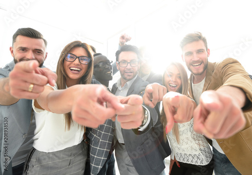 group of successful business people pointing at you