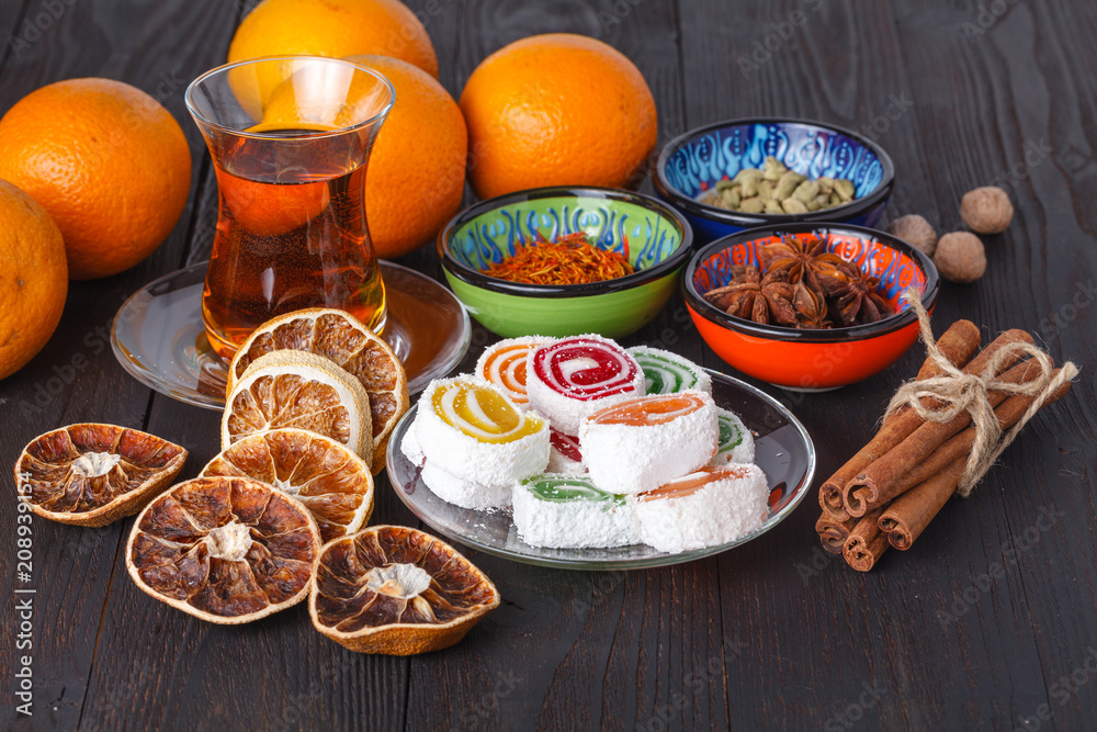 Lokum with tea and traditional sweets on table Lokum with tea and traditional sweets on table