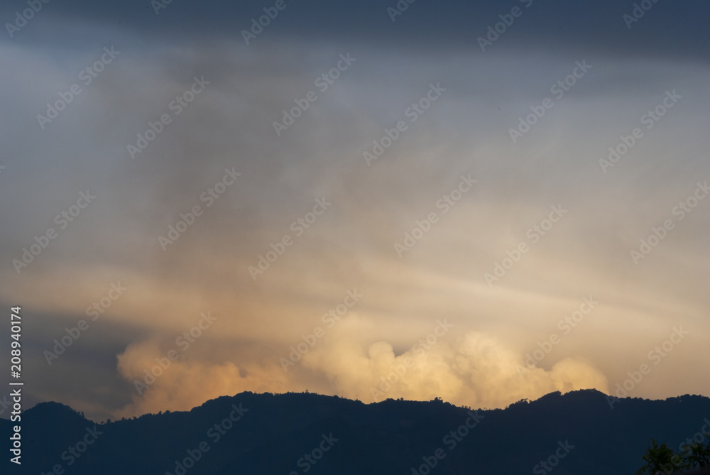 Cumulonimbus in dramatic sunset and mountain silhouette in central america, Guatemala.