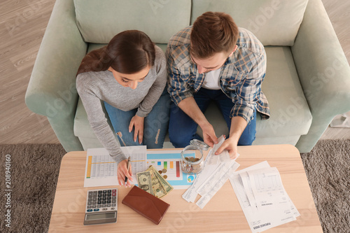 Couple with pay bills, calc...