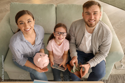 Happy family counting money...