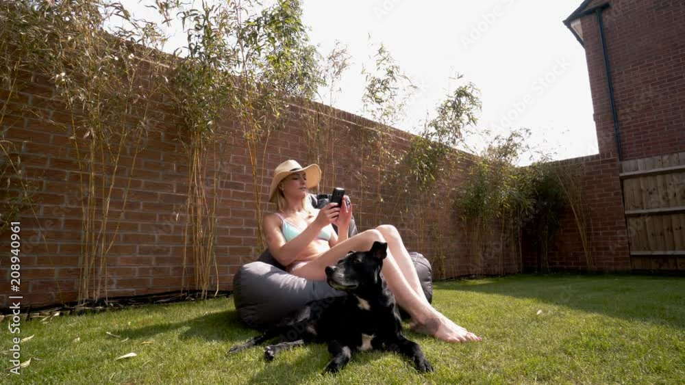 woman enjoying good weather in back garden 