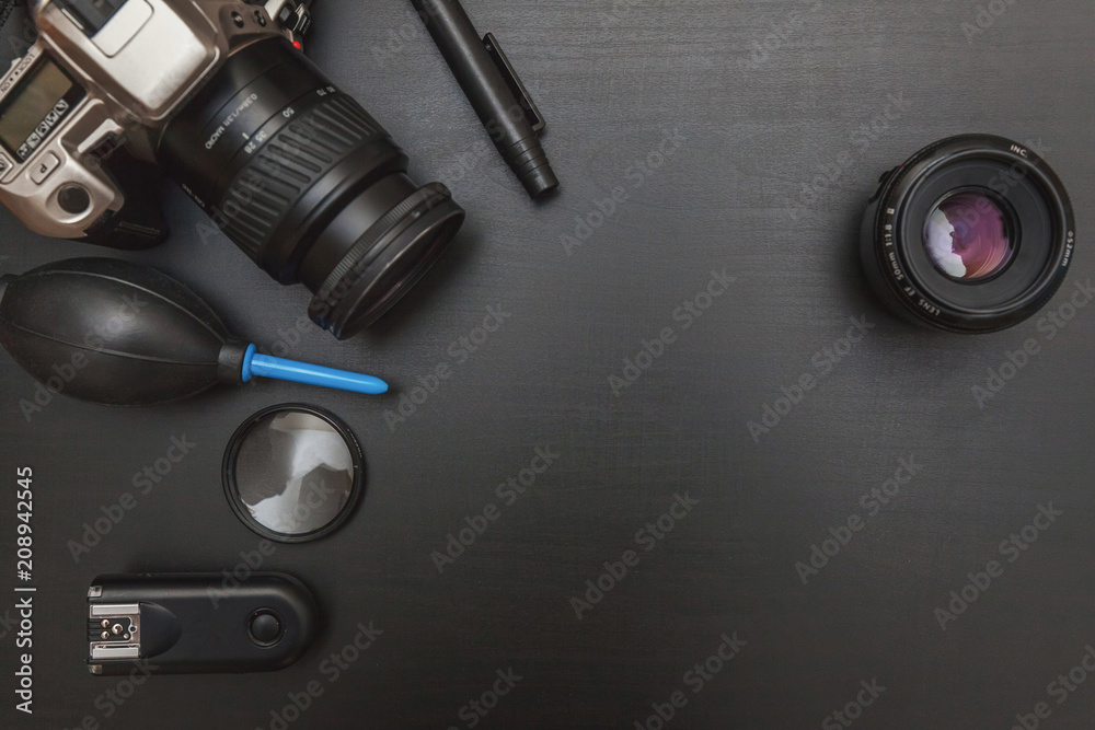 Top view of work space photographer with dslr camera system, camera  cleaning kit, lens and camera accessory on black table background. Hobby  journalism photography technology art concept Stock Photo | Adobe Stock