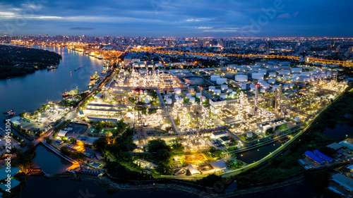 Aerial view of oil refinery near international port at night. Panorama of refinery plant at night. refinery factory and tank