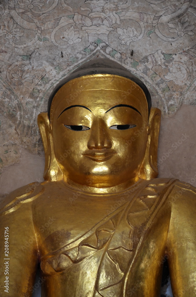 Ancient golden Buddha. Statue of 14th century. Bagan, Myanmar