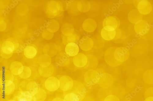 abstract yellow bokeh glitter sparkle background.