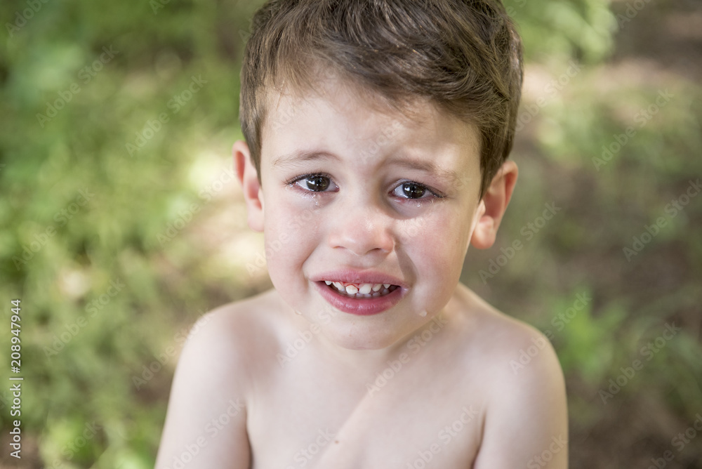 Little boy crying in the park of excitement Little boy crying in the park of excitement