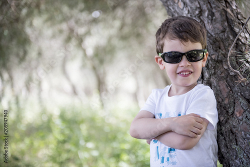 Little boy posing in the park
