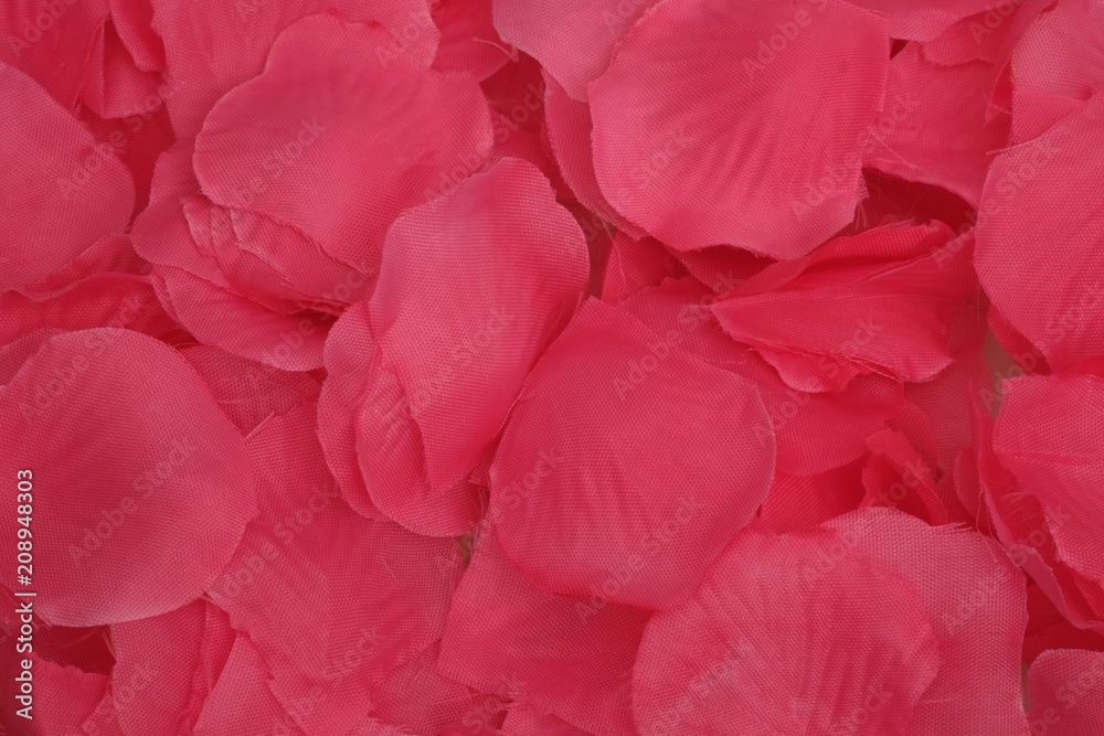 Obraz premium Background of artificial pink petals for the design of posters, banners and advertising