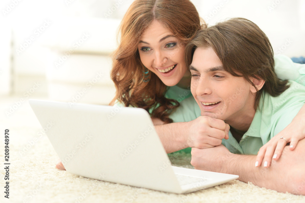 young couple using laptop
