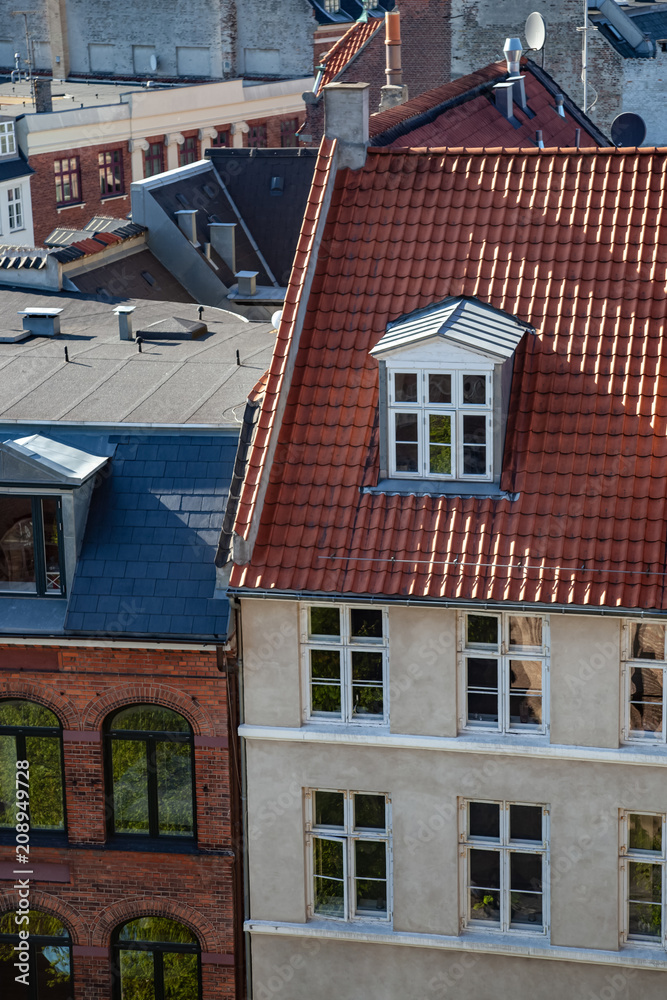 aerial view of various buildings and rooftops in copenhagen, denmark