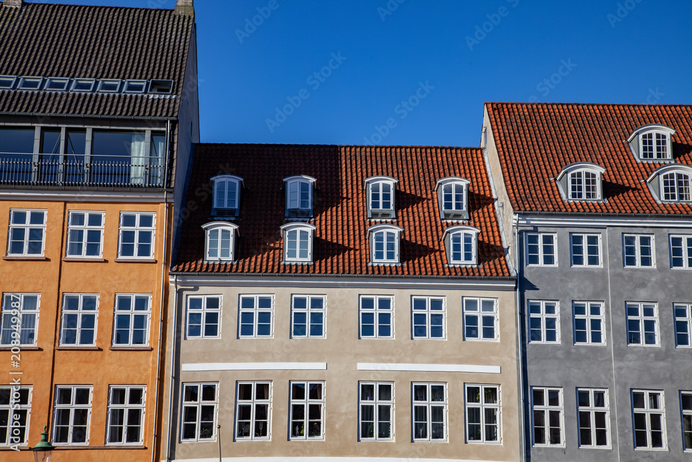 beautiful historical houses against blue sky in copenhagen, denmark