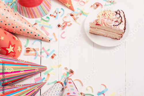 birthday cake and decoration on white wooden background