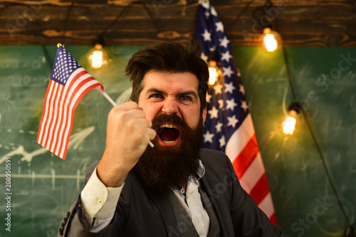 angry businessman with american flag close up.
