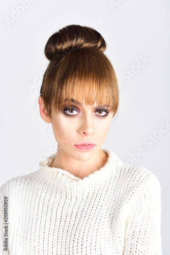 Fashion look concept. Beauty and hairdresser. Retro girl with elegant makeup on face. Trendy woman with stylish hair on white background. Makeup for vintage model with soft skin