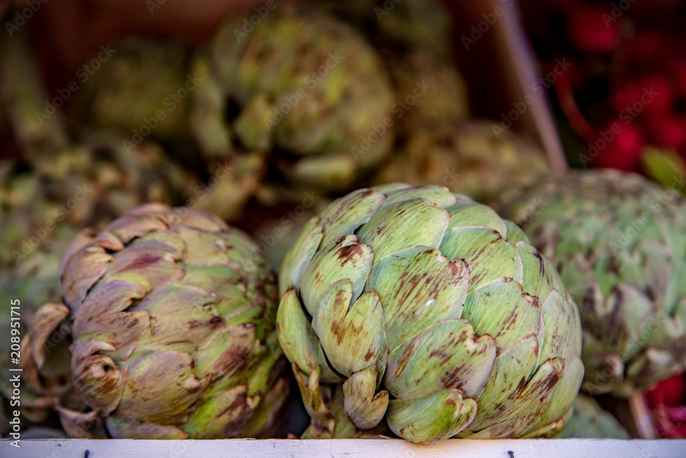 Fototapeta premium selective focus of artichokes on blurred background